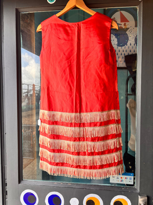 back view of vintage stagewear red dress with cream fringing