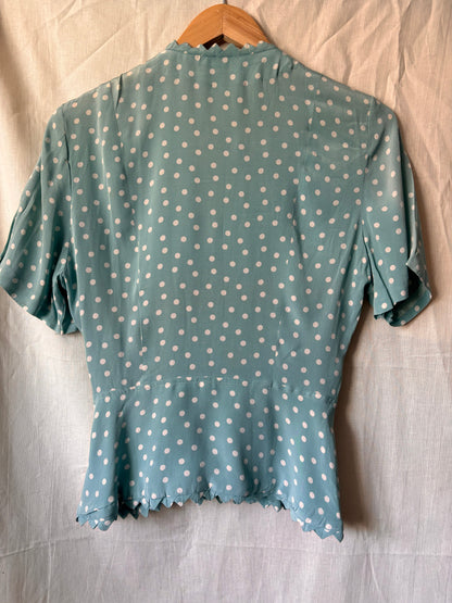 back view of 1940s polka dot blouse. Part of a two piece set
