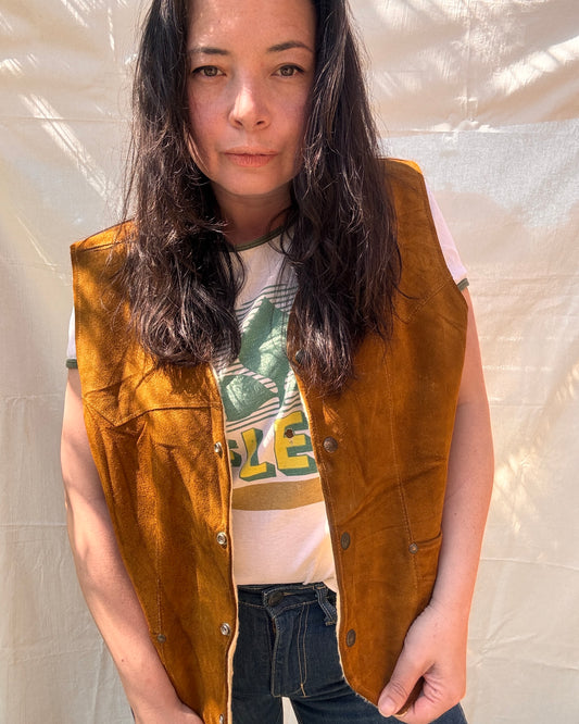 model wearing Vintage Pioneer Wear Suede Vest with vintage tshirt and denim