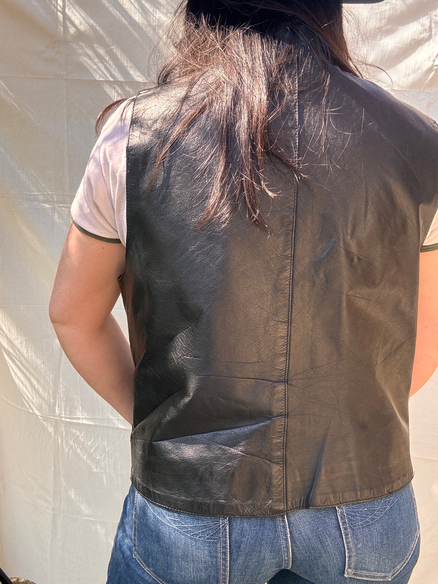 back view of Vintage 1980s Black Leather Waistcoat Vest on model