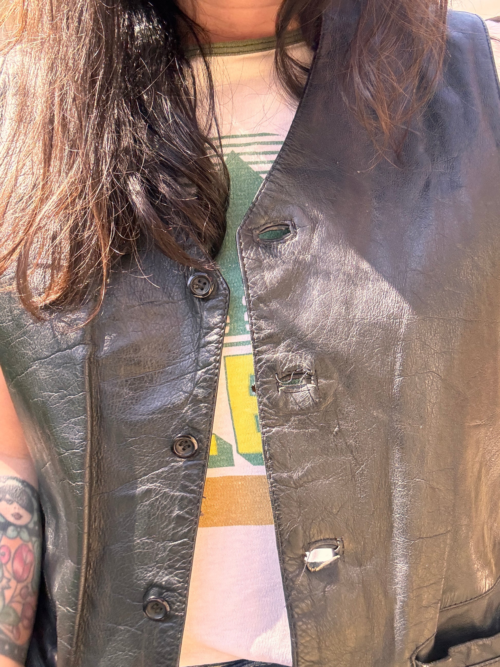 close-up of Vintage 1980s Black Leather Waistcoat Vest