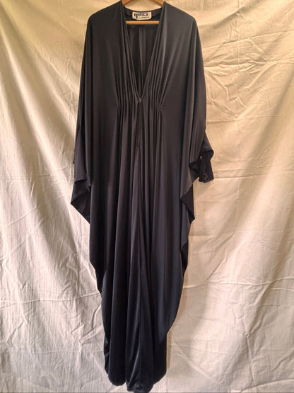 Front view of black 1970s Yuki kaftan
