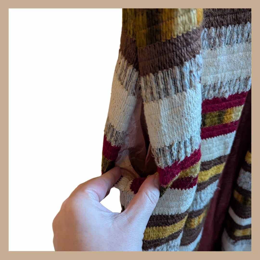 Pocket detail of vintage 1970s sleeveless duster waistcoat