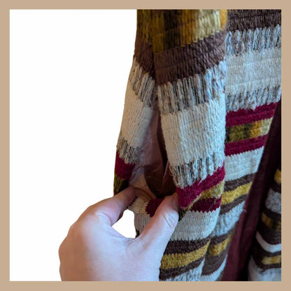 Pocket detail of vintage 1970s sleeveless duster waistcoat